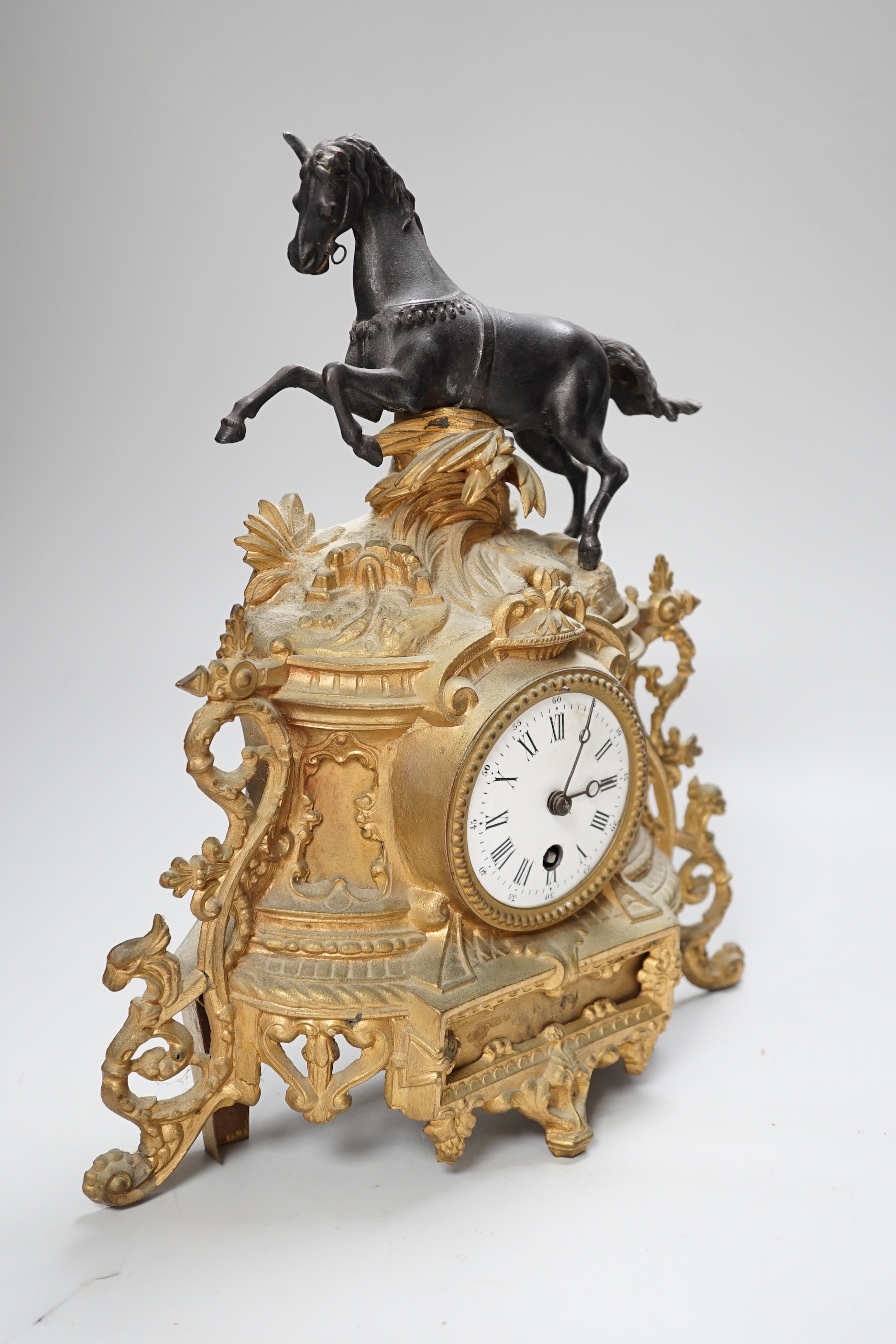 A late 19th century French gilt metal horse mounted clock, 35cm